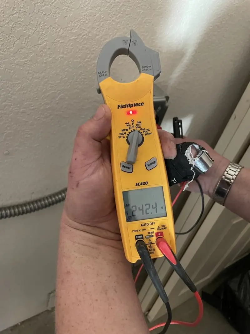 Voltage testing with clamp meter during Recessed Lighting Installation in Tuxedo